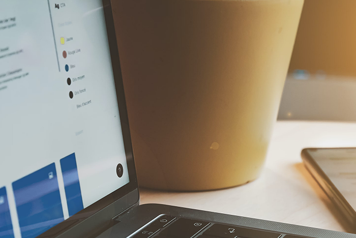 Image of a close up shot of a laptop with UI displayed on it