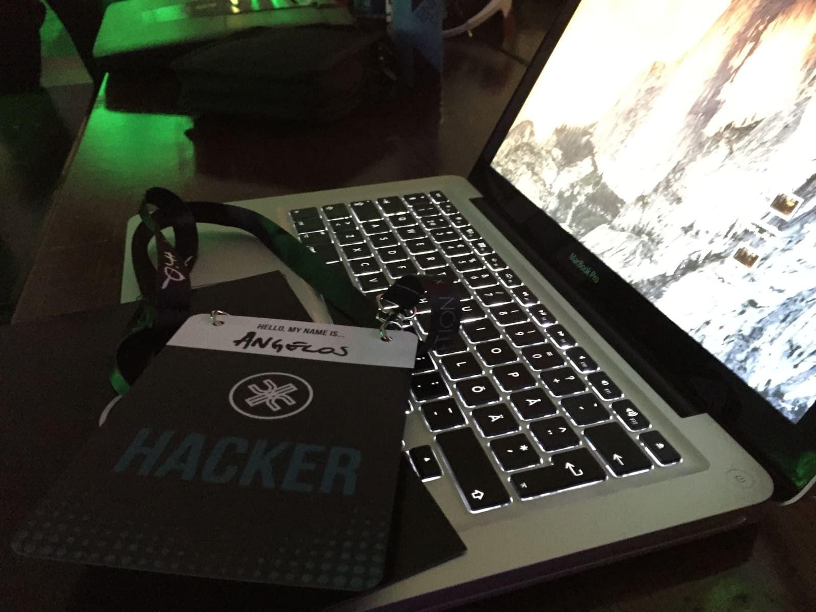 a badge and a computer taken at the Junction Hackathon