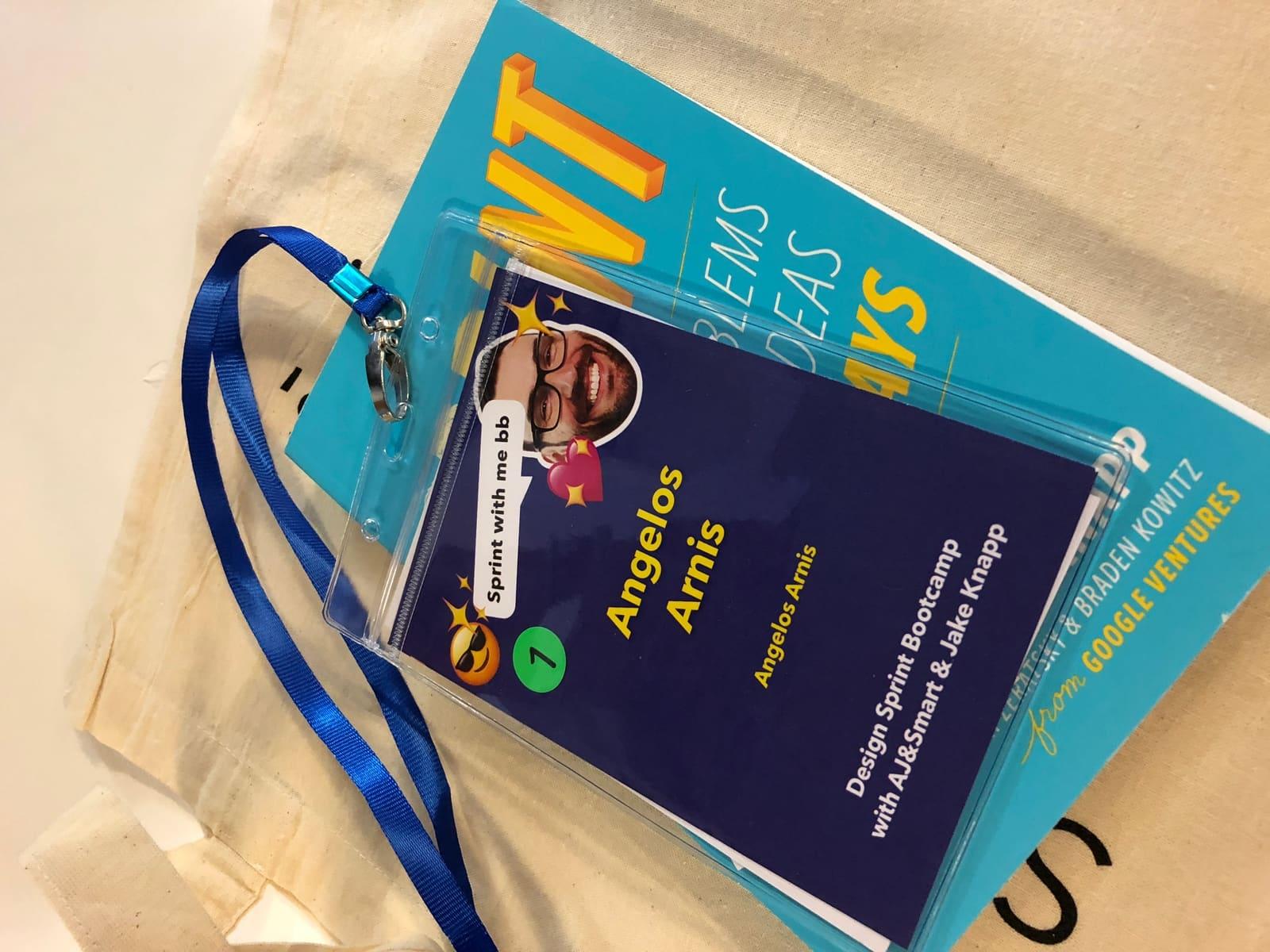 A badge and the book for Design Sprints, from a weekend workshop bootcamp with Jake Knapp